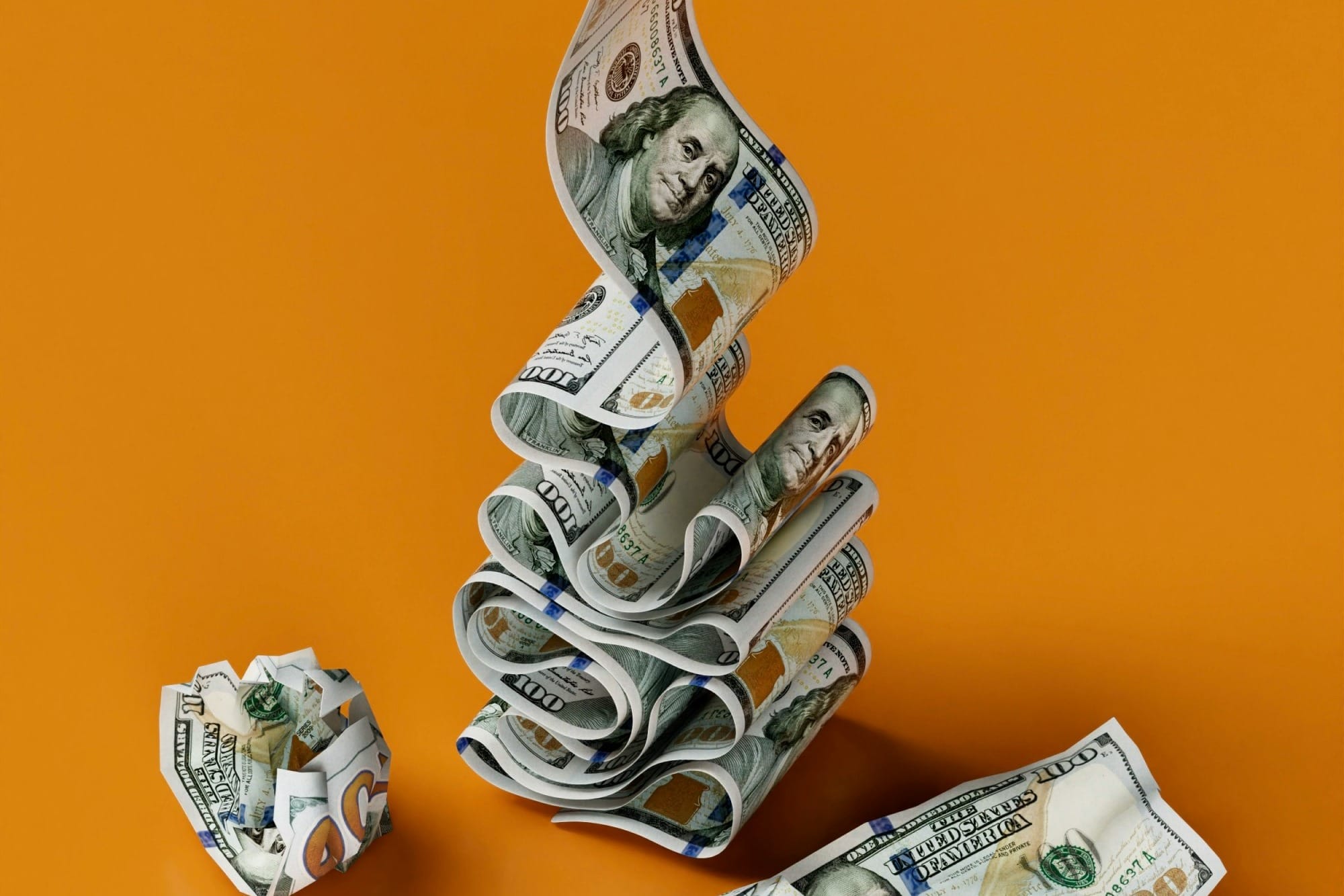 a stack of money sitting on top of a table