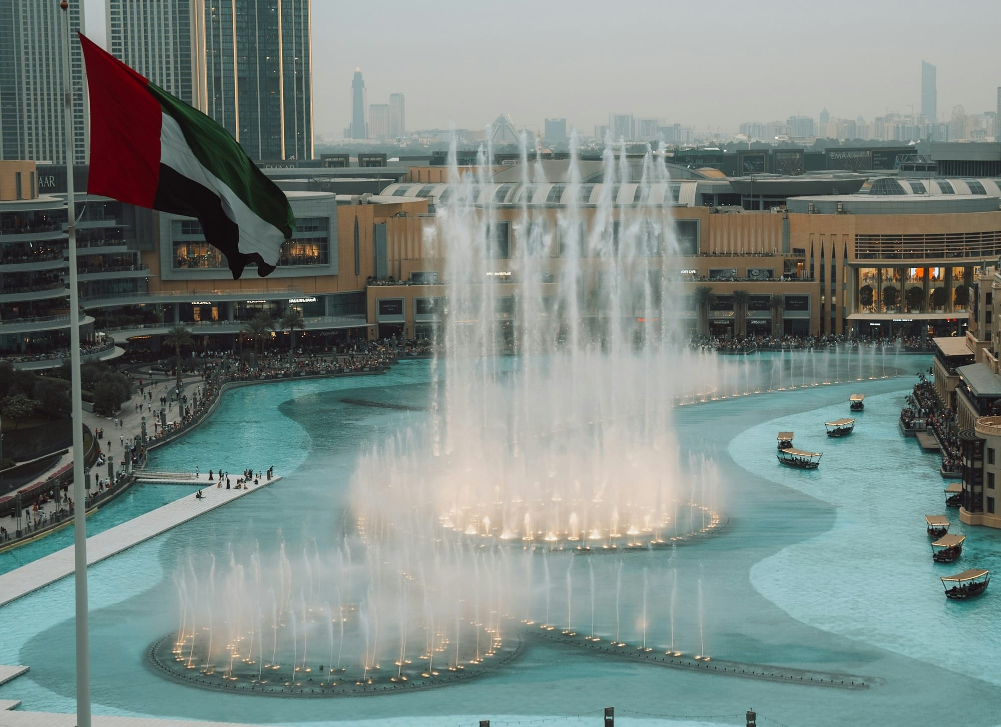 A large fountain with a flag on top of it