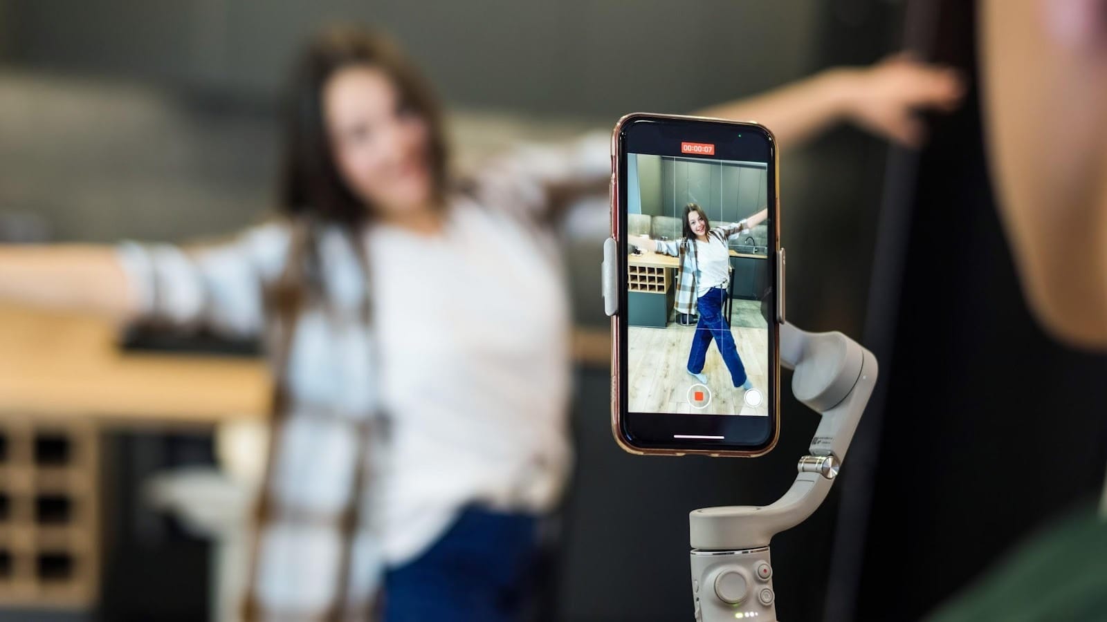 A person recording a blogger influencer. Source: https://www.freepik.com/free-photo/person-recording-blogger-influencer_45411903.htm#fromView=search&page=2&position=13&uuid=c0c00419-bc4a-4870-8352-e057b5e87f4d&query=+tiktok+on+mobile