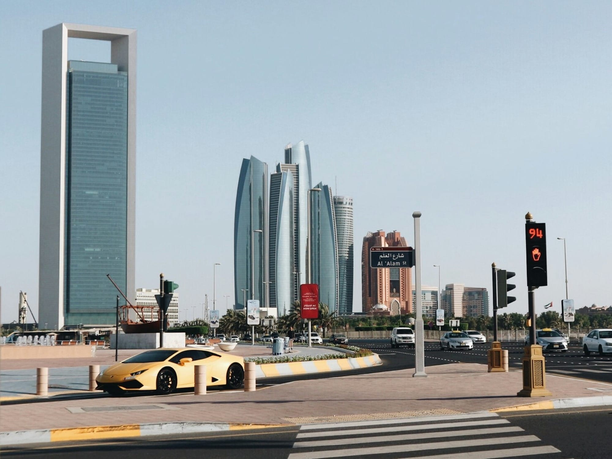 yellow car on road near building during daytime